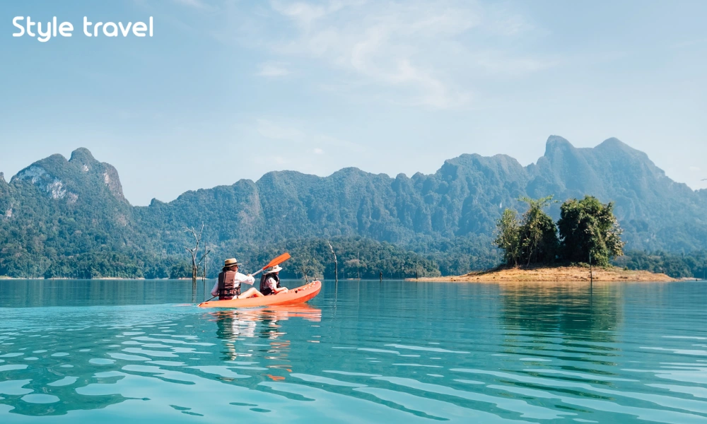 Visitors wearing life jackets while kayaking on Cheow Lan Lake