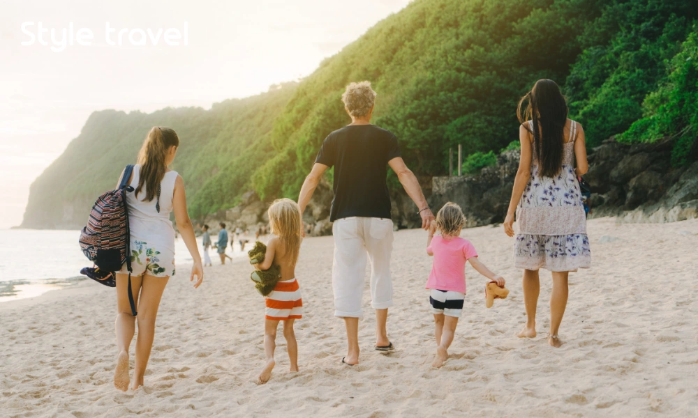 A family walking along a beach in Bali