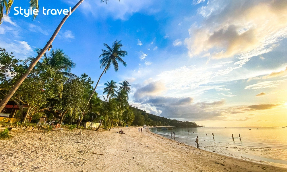 Haad Yao beach and palm-lined shoreline in Koh Phangan Thailand.