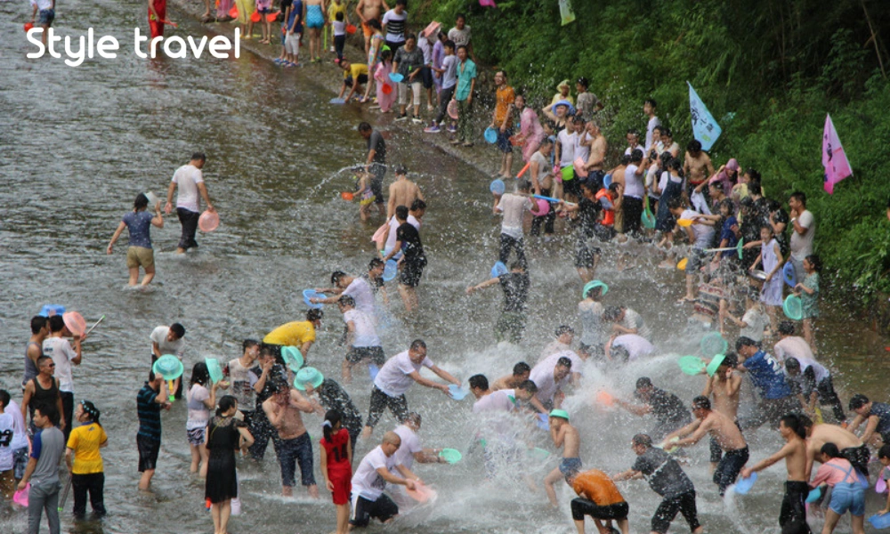 Water fights by the Old City moat during Songkran in Chiang Mai